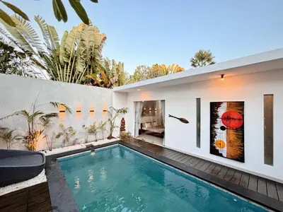 a swimming pool in the backyard of a house at Modern 2 BR villa seminyak center. in Seminyak