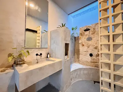 a bathroom with a sink and a mirror at Modern 2 BR villa seminyak center. in Seminyak