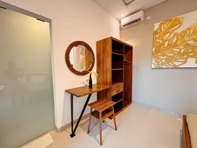 a dressing room with a table and a mirror at Modern 2 BR villa seminyak center. in Seminyak