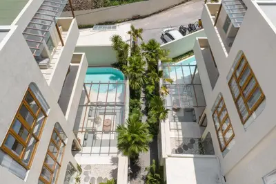 an aerial view of a building with a swimming pool at Alegria de la Vida in Canggu