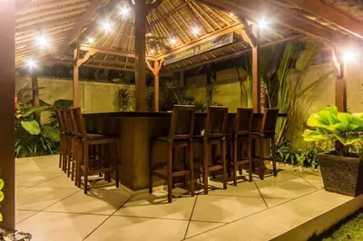 a group of chairs around a table in a gazebo at Luxury Villa AnTan Central Seminyak in Seminyak