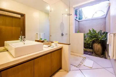 a bathroom with a sink and a shower at Luxury Villa AnTan Central Seminyak in Seminyak