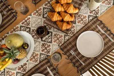 a table with a plate of food and a bowl of fruit at Spacious and Stylish Villa 3 Bedroom Seminyak in Denpasar