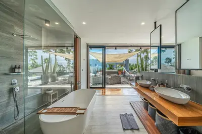 a bathroom with two sinks and a bath tub at Villa Aless - Designer 4BR Villa with Sauna, Jacuzzi, Ice Bath, Gym & Rooftop in Canggu