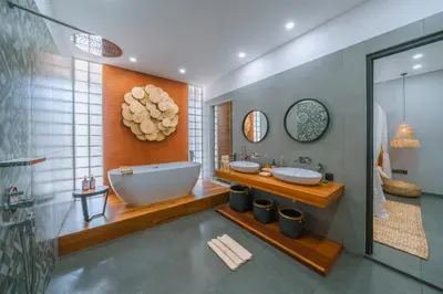 a bathroom with two sinks and a large tub at Villa Aless - Designer 4BR Villa with Sauna, Jacuzzi, Ice Bath, Gym & Rooftop in Canggu