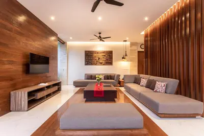a living room with a couch and a tv at The Amarta Villa in Jimbaran