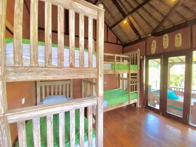 a group of bunk beds in a room at Blind Dog Inn in Sanur