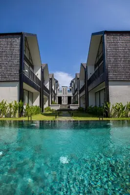 a pool of water in front of a building at 20 Suites Umalas in Canggu