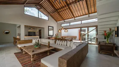 a living room with a couch and a table at Villa Emmy by Elite Havens in Seminyak