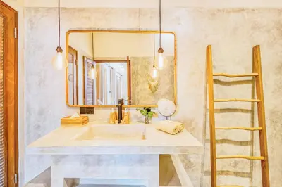 a bathroom with a sink and a mirror at NEW Fresh 3BD Prime Location Villa in Seminyak