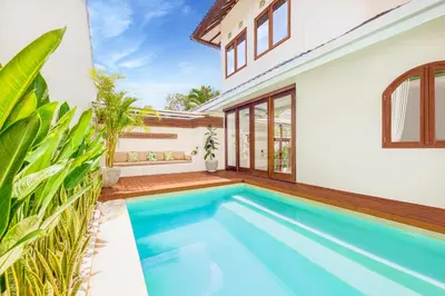a swimming pool in the backyard of a house at NEW Fresh 3BD Prime Location Villa in Seminyak