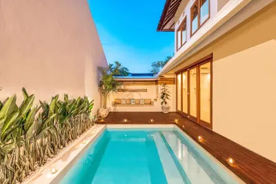 a swimming pool in the backyard of a house at NEW Fresh 3BD Prime Location Villa in Seminyak