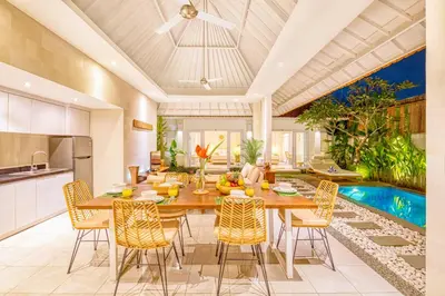 a kitchen and dining room with a table and chairs at PROMO 3BD Tropical Villa in Central Umalas in Canggu