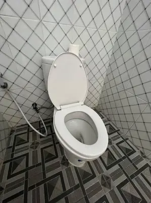 a bathroom with a white toilet in a stall at Villa Keane Bali 2 BR, Private Pool in Seminyak