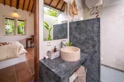 a bathroom with a sink in a room at Villa Fendi Seminyak in Seminyak