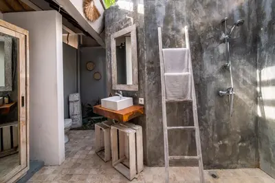 a bathroom with a ladder next to a sink at Villa Fendi Seminyak in Seminyak