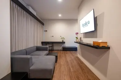 a living room with a couch and a table at Aralea Coliving in Denpasar