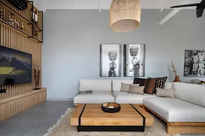 a living room with a couch and a coffee table at Ananda Villa by Betterplace in Jimbaran