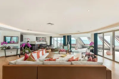 a large living room with a large couch at Double - Six, Luxury Hotel - Seminyak in Seminyak