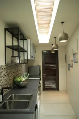 a kitchen with a sink and a counter at VILLA CELAVI 15 in Kerobokan