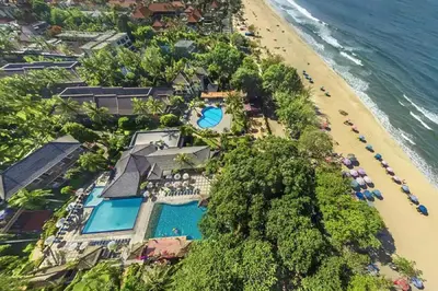 an aerial view of the resort and the beach at The Palmana Courtyard Jayakarta Residence 2 in Seminyak