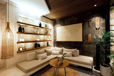 a living room with a couch and a table at Danu Villas Bali in Kerobokan