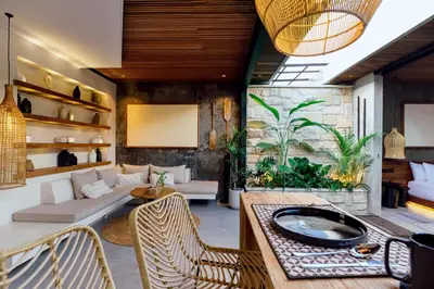 a living room with a couch and a table at Danu Villas Bali in Kerobokan