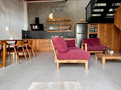 a kitchen with two purple chairs and a table at LINDT - Bali Invest Club in Dalung