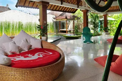 a wicker chair with a dragon on it in a resort lobby at Villa Domus De Janas in Seminyak