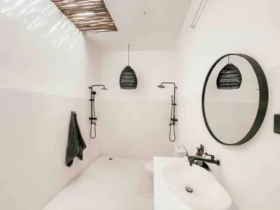 a white bathroom with a sink and a mirror at Renovated 2BD Oasis with POOL - CasaEra in Seminyak main hub in Seminyak