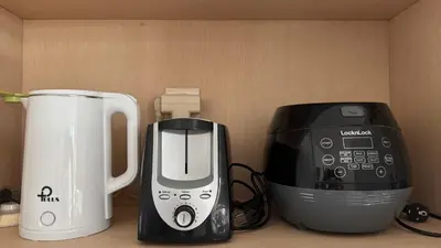 a coffee maker and a toaster sitting on a counter at Solaris Private Villa Club Residence Canggu in Canggu