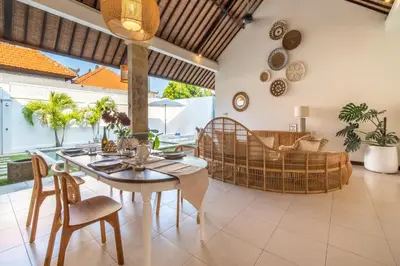 a dining room with a table and chairs at 2 bedroom Balinese private pool villa in Seminyak in Seminyak