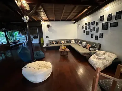 a living room with a couch and a table at My Secret Home in Seminyak