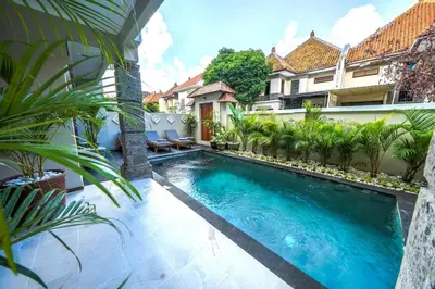a swimming pool in the middle of a building at Villa MARIE - KUTA - 6 Bedroom 4 Bathroom Villa - Great Location ! in Kuta