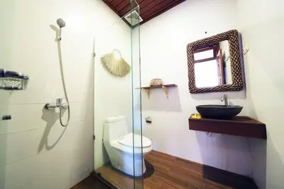a bathroom with a toilet and a sink at Villa MARIE - KUTA - 6 Bedroom 4 Bathroom Villa - Great Location ! in Kuta