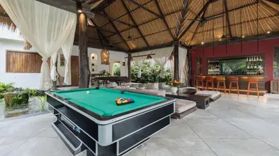 a pool room with a pool table in a resort at Ku Estate by Villa Finder in Seminyak