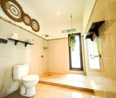a bathroom with a toilet and a shower at Villa VINO - LEGIAN - 3 bedroom - 3 bathroom Villa - Great Location in Seminyak