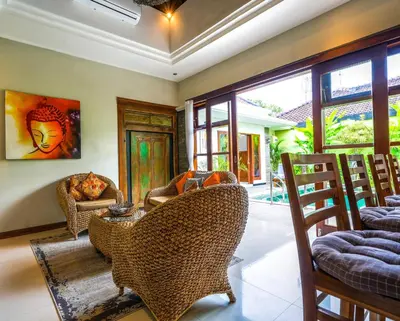 a living room with chairs and a table at Villa VINO - LEGIAN - 3 bedroom - 3 bathroom Villa - Great Location in Seminyak