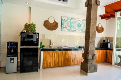 a kitchen with a black refrigerator and a counter at Villa CONOR - LEGIAN - SEMINYAK - 2 Bedroom 2 Bathroom Villa - Great Location in Seminyak