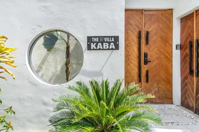 a house with a round mirror on the wall at The R Villa Kaba - incl. Motorbikes in Seminyak