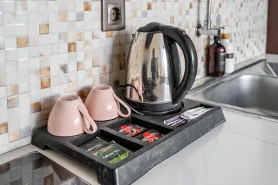 a kitchen counter with a mixer on top of a sink at The R Villa Toba - incl. Motorbikes in Seminyak