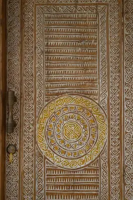 a wooden door with a gold design on it at Villa Kainara 2 - Cozy villa in center of Seminyak in Seminyak