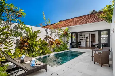 a swimming pool in the backyard of a villa at Villa Balik I Seminyak in Seminyak
