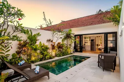 a swimming pool in the backyard of a villa at Villa Balik I Seminyak in Seminyak