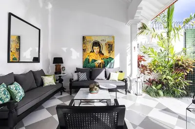 a living room with a couch and a table at Martini Beachside Villa 1 in Canggu
