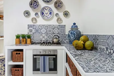 a kitchen with blue and white plates on the wall at Pineapple Hill 4 Bed Luxury in Seminyak