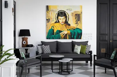 a living room with a couch and a painting at Martini Beachside Villa 3 in Canggu