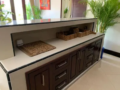 a kitchen counter with two baskets on top at Villa Olga in Seminyak