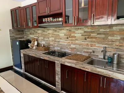 a kitchen with a sink and a counter top at Villa Olga in Seminyak
