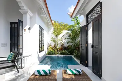 a swimming pool in the courtyard of a villa at Martini Beachside Villa 4 in Canggu